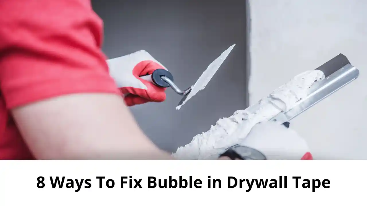 man fixing drywall tape bubble